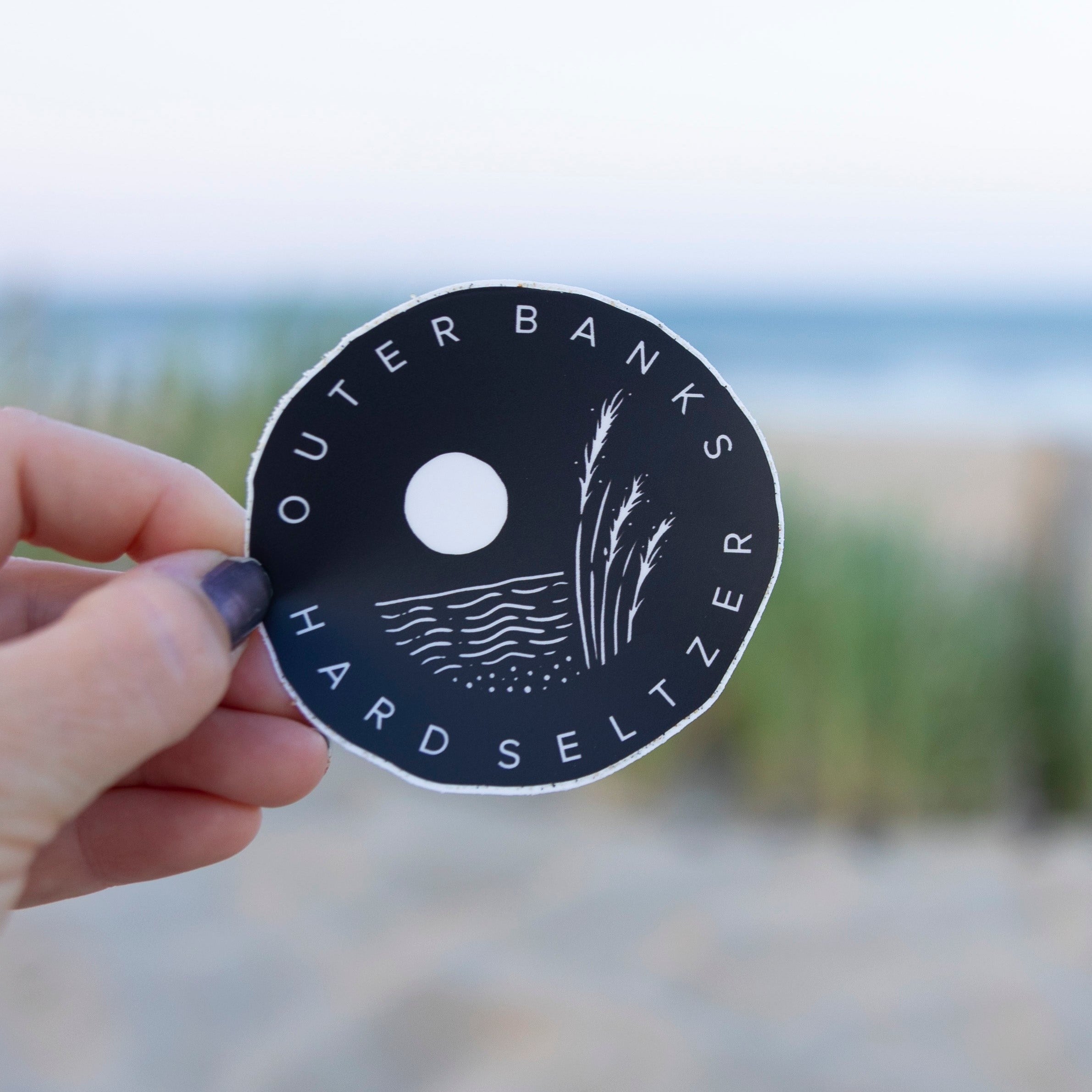 Outer Contents Sticker Black & White Outer Banks Hard Seltzer Sticker