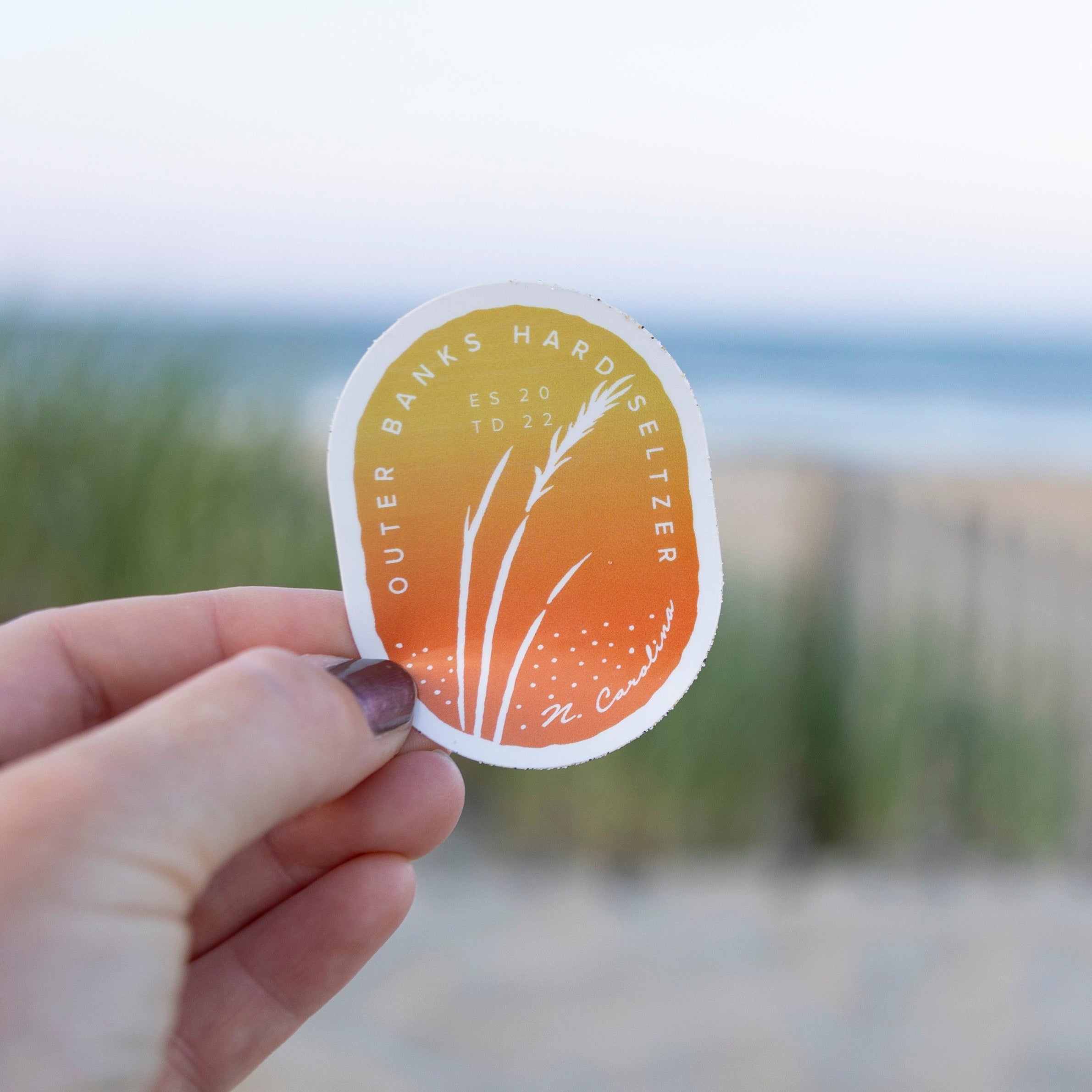 Outer Contents Sticker Orange Sea Oats Outer Banks Hard Seltzer Sticker