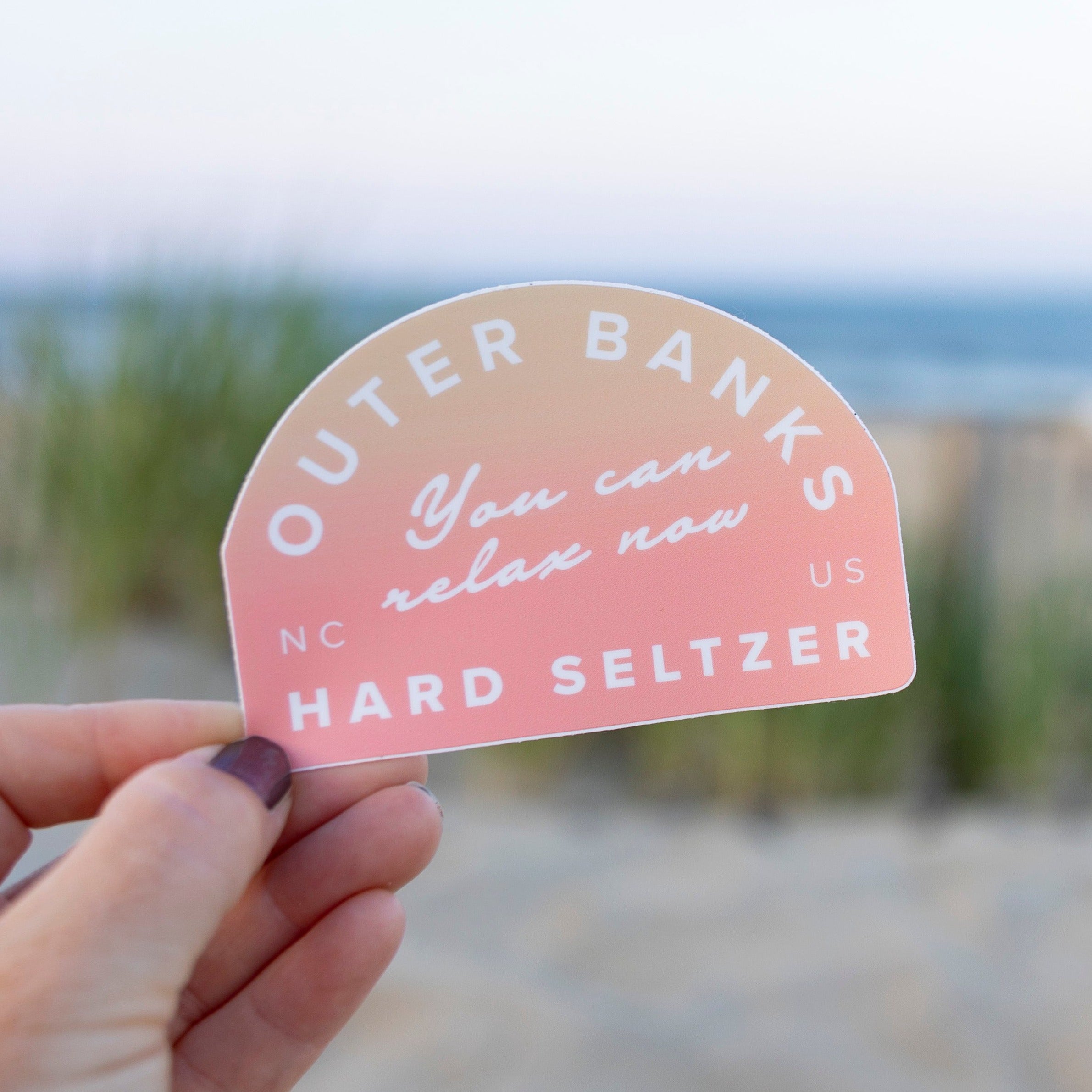 Outer Contents Sticker Pink & White Outer Banks Hard Seltzer Sticker